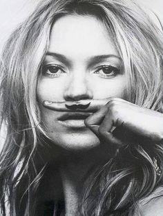 a black and white photo of a woman with fake mustaches on her face,