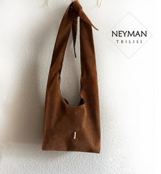 This one of a kind handmade boho bag made from a very high quality artificial vegan suede leather will attract everybody's attention. It is very lightweight and comfortable for use, with an inner side pocket for quick access to necessities. Perfect for a variety of activities; you can take it to work, shopping or even to the party. The bag closes with the zipper and the handle is adjustable your liking height. Dimensions: 16.1x14.1 in / 41x36 cm Washing instructions: dry cleaning (recommended) o Suede Bucket Bag For Daily Use, Soft Suede Leather Bucket Bag For Daily Use, Soft Leather Suede Bucket Bag For Daily Use, Soft Suede Bucket Bag For Daily Use, Suede Bucket Bag With Leather Handles, Suede Bucket Bag With Removable Pouch, Suede Bucket Shoulder Bag With Removable Pouch, Brown Suede Bucket Bag For Everyday Use, Brown Suede Bucket Bag For Daily Use