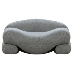 a large gray couch sitting on top of a white floor