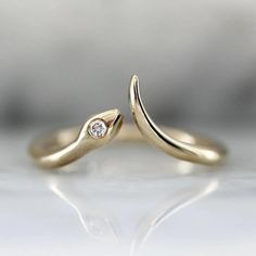 This open cuff snake ring is the epitome of cool girl chic as well as a stunning self care treat! Perfect to rock solo or snuggle a snake in a stackable ring. The smooth curves of the snake ring are crafted in 14k yellow gold and hold a glimmering white round brilliant cut diamond in the snake head.  The Details: Available in 925 Sterling Silver, 10K, 14K, 18K. .025 Carat White Round Brilliant Cut Diamond D E Color; VVS Clarity  Lab Grown Diamond Band Width is Approx. 1.50 mm Made to order in yo December Jewelry, Snake Ring Gold, Serpent Ring, Snake Ring Silver, Diamond Eyes, Rings Diamond, Animal Rings, Snake Ring, Gold Snake