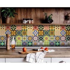 an image of a kitchen setting with colorful tiles on the backsplash and counter tops