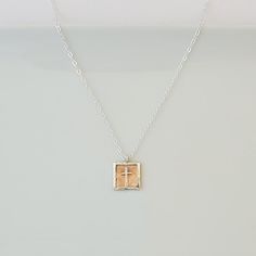 Just a touch of faith on this artfully designed necklace that is so perfect for gifting and every day wear. *  Hand-fabricated copper square edged with raised sterling silver, featuring tiny sterling silver cross set on top *  Sterling silver chain approx. 18"L with 1" extender, lobster clasp *  Pendant approx. 5/8"W x 3/4"L *  Made one at a time *  Due to the handmade nature of each piece, colors may vary slightly from photo. TURN AROUND TIME *  All of our jewelry pieces are made to order, and our turn around time is approximately 6-10 days.  If you need a rush order, please contact us to see if we can meet your deadline GIFTS - WE LOVE SENDING THEM FOR YOU! *  All jewelry pieces are nicely packaged in jewelry boxes with ribbon or tulle and ready to gift.  Prices are not included in the s Inspirational Silver Necklace For Her, Inspirational Handmade Necklaces For Gifts, Inspirational Handmade Necklace Gift, Silver Inspirational Necklace For Her, Inspirational Handmade Necklace For Gift, Inspirational Silver Necklace Gift For Her, Spiritual Cross Pendant Necklaces For Gift, Spiritual Cross Pendant Necklace For Gift, Inspirational Pendant Necklace As Gift