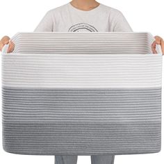 a person holding a mattress in their hands