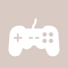 a white video game controller on a beige background