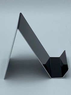 a metal object on a white surface with no one in it's place to see the image