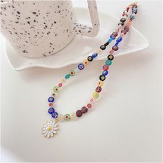 This Necklace With A Mini Spring looks special and cute! Color: Gold Plated Material: Alloy Measurement: Length: 16" + 2" Brand: Coseey Rainbow Beaded Necklace, Kpop Fandom, Daisy Pendant, Must Buy, Rainbow Beads, Flower Pendant Necklace, Glass Bead Necklace, Flower Pendant, Necklace Handmade