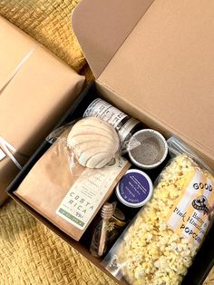 an open box filled with popcorn and other items