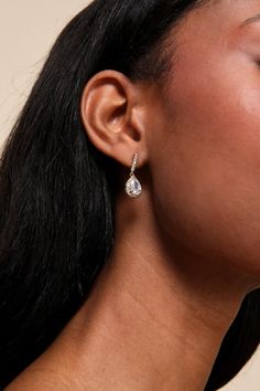 Add an expensive vibe to any date-night look with the Lulus Posh Drama Gold Rhinestone Teardrop Earrings! Shiny gold-toned metal shapes these stunning earrings that have a teardrop-shaped silhouette with a halo of clear rhinestones along the posts surrounding the rhinestone focals. Post Backs. 1" Long. 70% Brass, 30% Cubic Zirconia. Imported. Lulus | Posh Drama Gold Rhinestone Teardrop Earrings. Earrings Teardrop, Lulu Fashion, Gold Rhinestone, Stunning Earrings, Jewelry Inspo, Night Looks, Clear Rhinestones, Teardrop Earrings, Gold Tone Metal