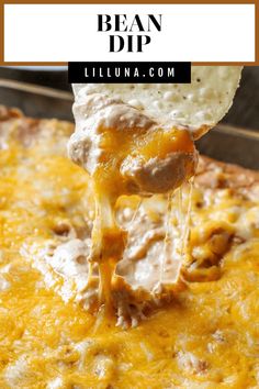 a tortilla casserole with cheese being lifted from the casserole