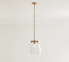 a clear glass light fixture hanging from a ceiling