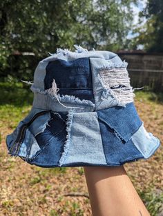 Distressed denim bucket hat with patch work details. Made from scrap materials from denim jeans. Hat is reversible. Distressed Denim Hat For Streetwear, Casual Cotton Patchwork Hat, Denim Bucket Hat In Medium Wash, Spring Distressed Denim Blue Hat, Casual Distressed Cotton Bucket Hat, Medium Wash Denim Bucket Hat, Casual Distressed Bucket Hat, Denim Hat Outfit, Jean Hats