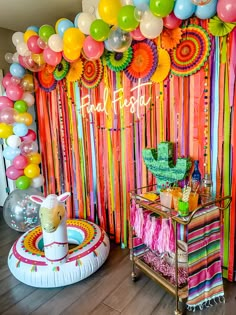 a colorful party with balloons and streamers