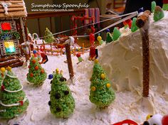 there are many christmas trees made out of rice krispy kreme treats on the table