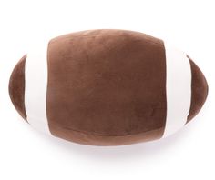 a brown and white football pillow on a white background