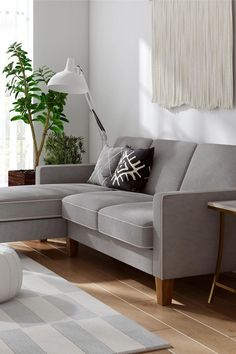 a living room scene with focus on the corner sofa