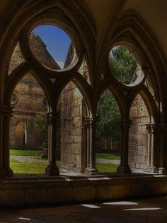 an old building with arches and stone floors