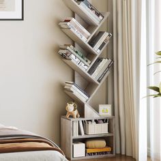 a bed room with a neatly made bed and a book shelf