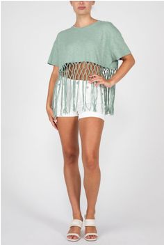 Featuring short sleeves and a pretty sage green, the Miss Me Women's Fringe Tee Shirt is the perfect addition to any cowgirl's wardrobe. Complete with fringe accents on the trim, its rib knit crew neck adds a touch of comfort to this stylish and fun-loving piece. Gentle machine was with like colors in cold water Tumble dry low Summer Short Sleeve Tops With Tassels, Casual Short Sleeve Tops With Tassels, Summer Tassel Short Sleeve Tops, Summer Fringe Tops With Short Sleeves, Summer Short Sleeve Fringe Top, Summer Fringe Short Sleeve Top, Casual Short Sleeve Fringe T-shirt, Casual Summer Fringe T-shirt, Spring Short Sleeve Tops With Fringe