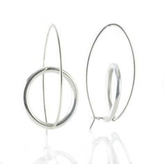 Silver Earrings - Sterling silver twist on classic hoops, perfect for everyday wear. Available in matte, oxidized, and polished finishes, these earrings effortlessly blend style and versatility to complement any look with understated elegance. Modern Twist Silver Earrings For Everyday, Everyday Silver Earrings With A Modern Twist, Modern Silver Wrap Earrings For Everyday, Silver Hoop Earrings With A Modern Twist, Contemporary Silver Hoop Earrings For Everyday, Modern Hand Forged Hoop Earrings, Minimalist Silver Hoop Earrings With Oxidized Finish, Small Hoop Oxidized Minimalist Earrings, Minimalist Small Hoop Earrings With Oxidized Finish