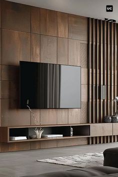 a modern living room with wood paneling and a flat screen tv on the wall