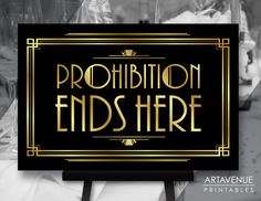 a black and gold sign that says prohibition ends here on the side of a table