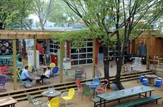 several tables and chairs are set up outside