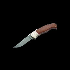 a knife that is on top of a white surface with a brown handle and black blade