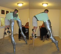 the man is wearing silver pants and climbing on two wooden ladders with one leg up