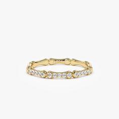 a yellow gold ring with white diamonds