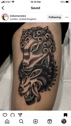 a black and white photo of a tattoo on someone's leg with an image of a lion