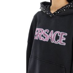 Find VERSACE Cotton Logo Sweatshirt on Editorialist. - Composition: 100% cotton - Long sleeves - Hood - Metal applications - Kangaroo pocket - Ribbed trims - Front logo detail - Machine wash (delicate) - Made in Portugal - Trendy Embroidered Logo Top For Streetwear, Trendy Streetwear Tops With Embroidered Logo, Trendy Streetwear Top With Embroidered Logo, Cotton Hoodie With Logo Detail Relaxed Fit, Cotton Hoodie With Logo In Relaxed Fit, Trendy Embroidered Logo Tops For Loungewear, Designer Cotton Hooded Hoodie, Cotton Tops With Embroidered Logo For Loungewear, Spring Cotton Tops With Logo Detail