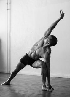 a man standing on one leg in a yoga position