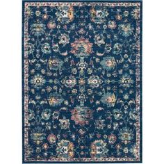 a blue rug with an ornate design on the front and back side, in various colors