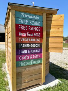 a sign on the side of a building advertising farm stand