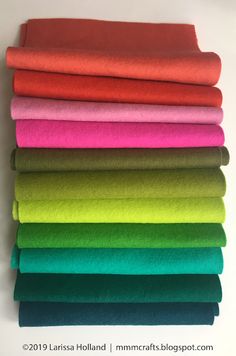 a stack of different colored felts sitting on top of each other