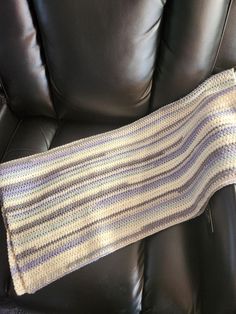 This is perfect for anyone wanting to curl up and read or watch television as it will cover the lap and knees. Makes a nice warm throw for anyone in a wheelchair or elderly person who just needs a small covering for their lap.  The lap blanket is in subtle shades of blues, grays and cream. Blanket measures 28 inches wide by 30 inches long. Machine wash and either dry on low or lay flat to dry. Comes from a smoke free home. Item is ready to ship Wheelchair Blanket, Reading Blanket, Teen Blankets, Cream Blanket, Lap Blanket, Crochet Throw, Blanket Gift, Wheelchair, Shades Of Blue