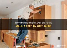 a man on a ladder working on cabinets in a room that is under construction with the words securing kitchen cabinet to the wall