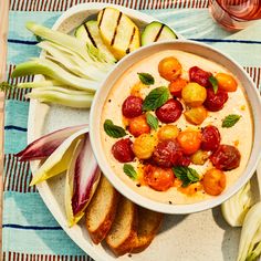 a white bowl filled with food on top of a table