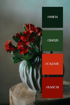 red flowers in a white vase with green and red color swatches on the bottom