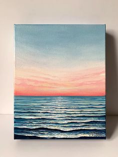 a painting of the ocean at sunset with pink and blue clouds in the sky above it