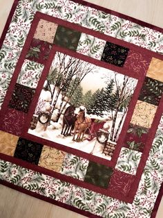 a quilted christmas scene with horses pulling a sleigh