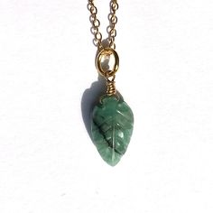 Emerald Leaf Pendant A stunning Emerald carved Leaf Pendant on a 24k Gold Plated Sterling Silver Chain.  This Pendant is handmade with 24k Gold Plated Sterling Silver wire on a gold plated sterling silver chain.  Emerald - Love, Intuition and Abundance  It's a beautiful piece of Jewellery, that's great as for everyday wear - a great gift.  Please see the other Leaf Pendant Necklaces we have in our store.  The necklace comes in its own Organza bag, Sweet Matchbox style box. Ready to give as a gif Handmade Yellow Gold Jade Necklaces, Handmade Yellow Gold Jade Necklace, Handmade Yellow Gold Jewelry For May Birthstone, Dainty Gold Plated Emerald Necklace As A Gift, Gold Briolette Emerald Necklace Gift, Dainty Gold Emerald Necklace Gift, Gold Emerald Gemstone Necklace Gift, Minimalist Gold Emerald Necklace As Gift, Delicate Gold Emerald Necklace Gift