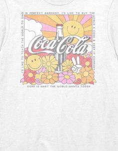 a white t - shirt with the words coca cola on it and flowers in front