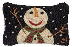 a pillow with a snowman on it