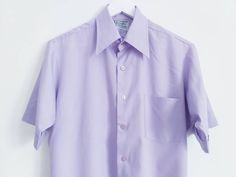 Lilac blouse, Ladies dress shirt, Button Down Shirt, Short sleeve shirt, Solid blouse, blouse with pocket, Vintage blouse, Lilac top, Size L Good vintage condition Need to be ironed Measurements (lying flat): Pit to pit 22''/56cm Length 30''/76cm Sleeve length 10''/25cm Please check measurements to insure a proper fit. Remember to allow yourself some extra room for movement. You can compare measurements with something from your closet that fits you well. Please feel free contact me if you need additional measurements or have any questions! This blouse will come to you freshly laundered and ready to wear. SHIPPING * I ship from Europe (Latvia), so please allow 2 to 4 weeks for the package to arrive if you live overseas. * Europe 1 to 2 weeks. For courier delivery please send me your full ph Summer Formal Short Sleeve Collared Shirt, Formal Summer Button-up Short Sleeve Shirt, Formal Summer Short Sleeve Button-up Shirt, Formal Button-up Top With Pockets, Solid Color Short Sleeve Dress Shirt For Spring, Solid Short Sleeve Dress Shirt For Spring, Formal Shirt With Pockets And Lapel Collar, Formal Summer Shirt With Pockets, Relaxed Fit Collared Dress Shirt With Pockets