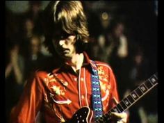 the rolling stones guitarist playing his guitar