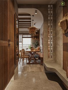 a dining room table and chairs in front of a wooden wall with an arched doorway