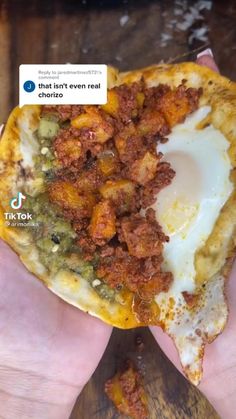 someone holding up a piece of food with an egg in it's center and the text that says, i don't even eat chorro