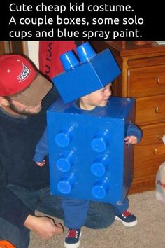 a man and his son are dressed up like legos to play with each other