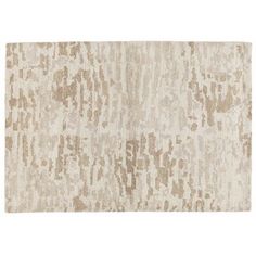 a beige rug with an abstract design on the top and bottom, it is made out of